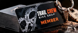 Plastic bike shop Member Keytags with a pre-punched hole, shown on a keyring